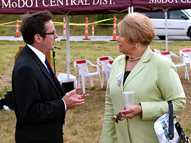 Karen M. Miller, Boone County District I Commissioner, speaks with Kurt Schaefer, Missouri State Senator for District 19, at the groundbreaking ceremony for the airport interchange