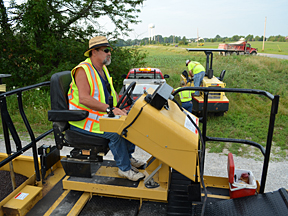 Bobby Craig begins to move the chip spreader to the job site