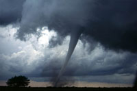a tornado funnels touches down